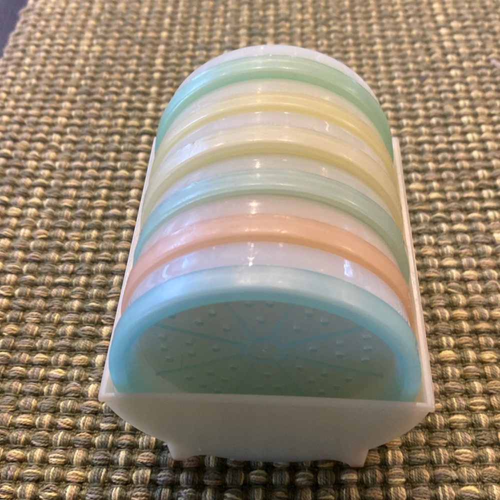 Vintage Tupperware Wagon Wheel Colored Coasters in Caddy. Pastel Colors